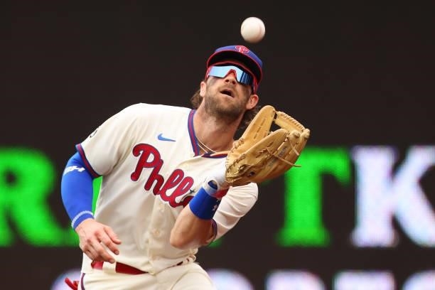 Right fielder Bryce Harper of the Philadelphia Phillies makes a catch on a ball hit by Carson Kelly of the Arizona Diamondbacks during the third...