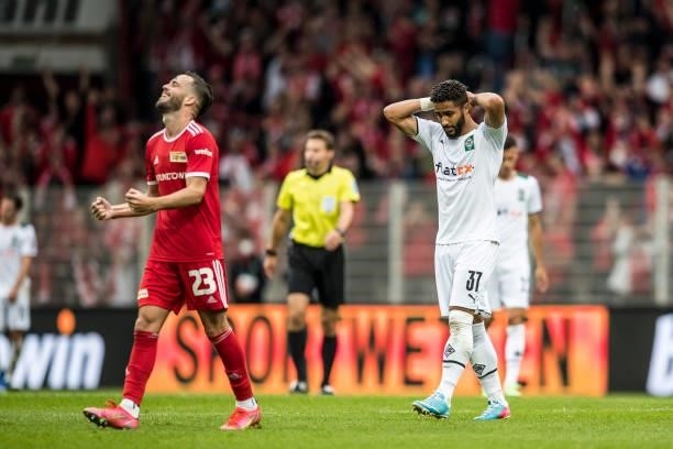 Niko Gießelmann of Union and Keanan Bennetts of Borussia Moenchengladbach react after the Bundesliga match between 1.FC Union Berlin and Borussia...