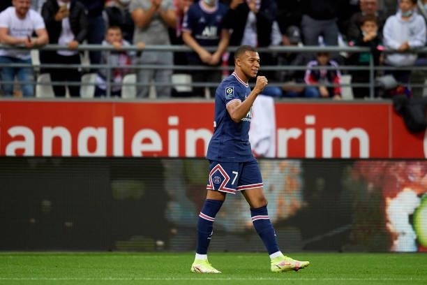 Kylian Mbappe of PSG celebrates after scoring his sides first goal during the Ligue 1 Uber Eats match between Reims and Paris Saint Germain at Stade...