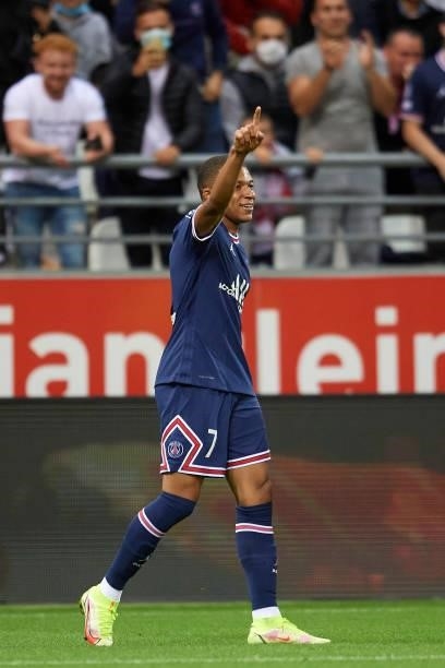 Kylian Mbappe of PSG celebrates after scoring his sides first goal during the Ligue 1 Uber Eats match between Reims and Paris Saint Germain at Stade...