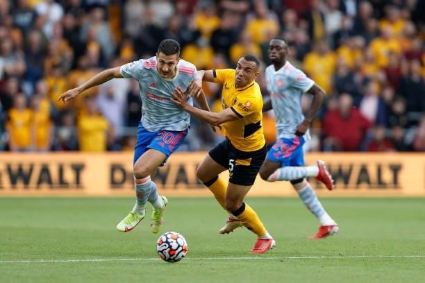 Diogo Dalot of Manchester United and Fernando Marcal of Wolverhampton Wanderers during the Premier League match between Wolverhampton Wanderers and...