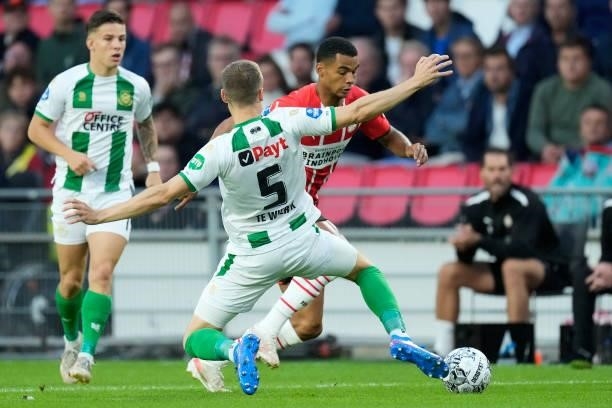 Mike te Wierik of FC Groningen, Cody Gakpo of PSV during the Dutch Eredivisie match between PSV v FC Groningen at the Philips Stadium on August 28,...