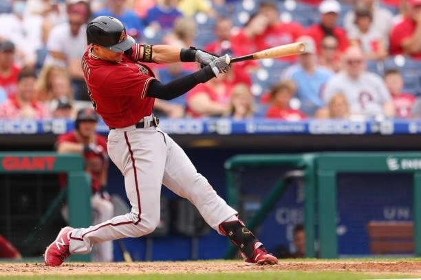 Nick Ahmed of the Arizona Diamondbacks hits an RBI double against the Philadelphia Phillies during the seventh inning of a game at Citizens Bank Park...