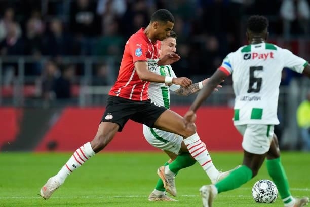 Cody Gakpo of PSV, Tomas Suslov of FC Groningen during the Dutch Eredivisie match between PSV v FC Groningen at the Philips Stadium on August 28,...