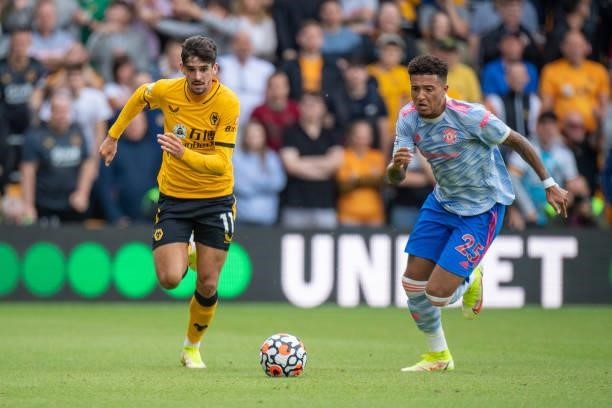 Francisco Trincao of Wolverhampton Wanderers and Jadon Sancho of Manchester United in action during the Premier League match between Wolverhampton...