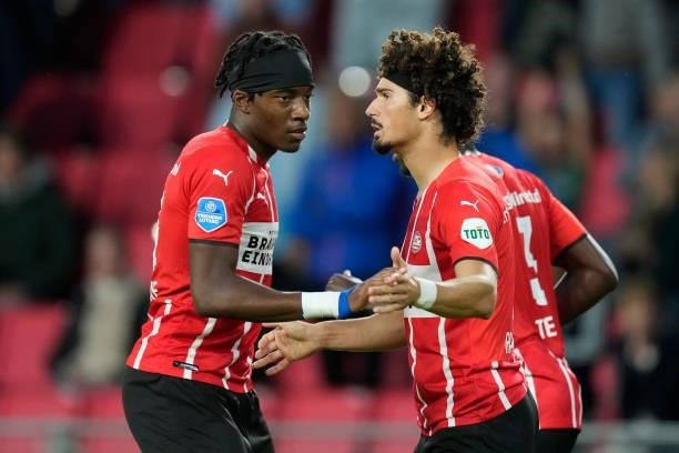 Andre Ramalho of PSV celebrates 2-2 with Noni Madueke of PSV during the Dutch Eredivisie match between PSV v FC Groningen at the Philips Stadium on...