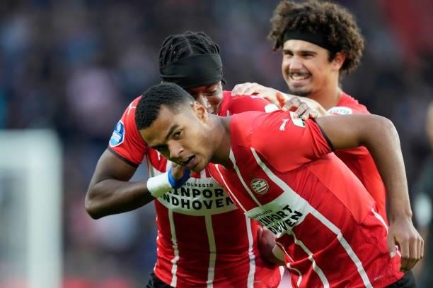 Cody Gakpo of PSV celebrates 1-0 with Noni Madueke of PSV, Andre Ramalho of PSV during the Dutch Eredivisie match between PSV v FC Groningen at the...