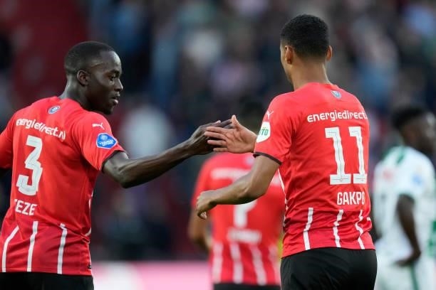 Cody Gakpo of PSV celebrates 1-0 with Jordan Teze of PSV during the Dutch Eredivisie match between PSV v FC Groningen at the Philips Stadium on...