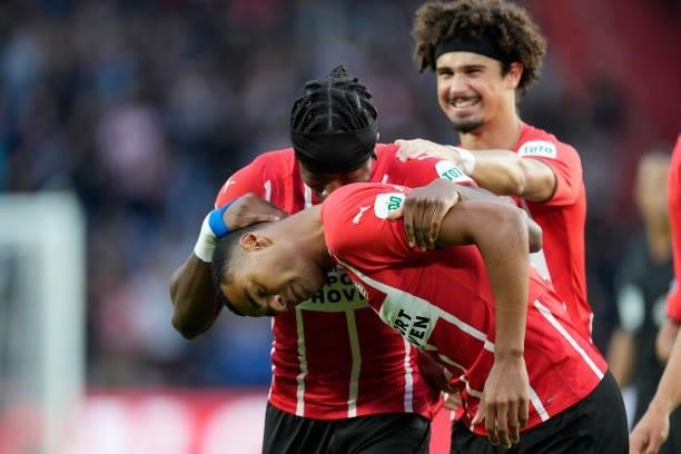 Cody Gakpo of PSV celebrates 1-0 with Noni Madueke of PSV, Andre Ramalho of PSV during the Dutch Eredivisie match between PSV v FC Groningen at the...
