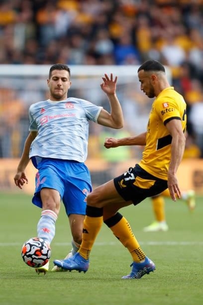 Diogo Dalot of Manchester United and Romain Saiss of Wolverhampton Wanderers during the Premier League match between Wolverhampton Wanderers and...