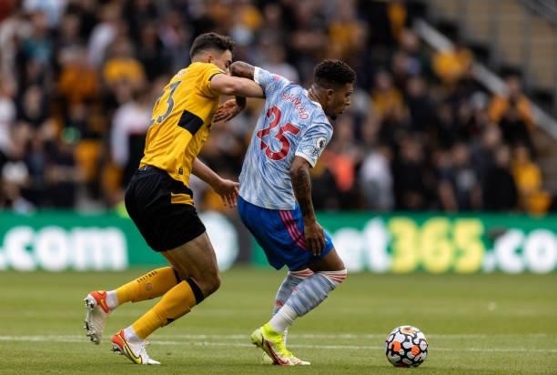 Wolverhampton Wanderers' Max Kilman competing with Manchester United's Jadon Sancho during the Premier League match between Wolverhampton Wanderers...