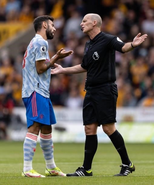 Manchester United's Bruno Fernandes pleads with referee Mike Dean during the Premier League match between Wolverhampton Wanderers and Manchester...