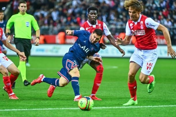 Lionel MESSI of PSG and Wout FAES of Reims during the Ligue 1 Uber Eats match between Reims and Paris Saint Germain at Stade Auguste Delaune on...
