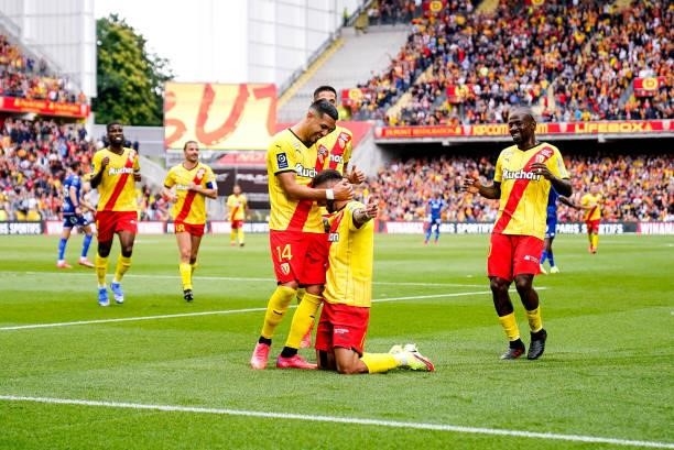 Jonathan CLAUSS of RC Lens celebrate his goal with Facundo MEDINA of RC Lens and Gael KAKUTA of RC Lens during the Ligue 1 Uber Eats match between...