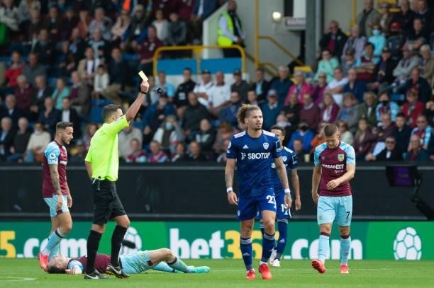 Kalvin Phillips of Leeds United is shown a yellow card during the Premier League match between Burnley and Leeds United at Turf Moor, Burnley, UK on...