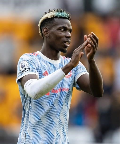 Manchester United's Paul Pogba applauds his sides travelling supporters during the Premier League match between Wolverhampton Wanderers and...