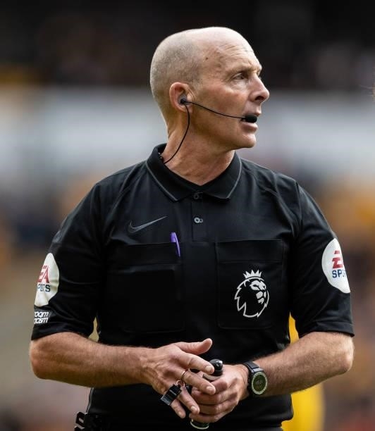 Referee Mike Dean during the Premier League match between Wolverhampton Wanderers and Manchester United at Molineux on August 29, 2021 in...