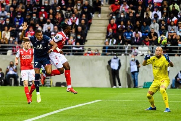 Kylian Mbappe of Paris Saint Germain heads the ball for a goal during the Ligue 1 Uber Eats match between Reims and Paris Saint Germain at Stade...