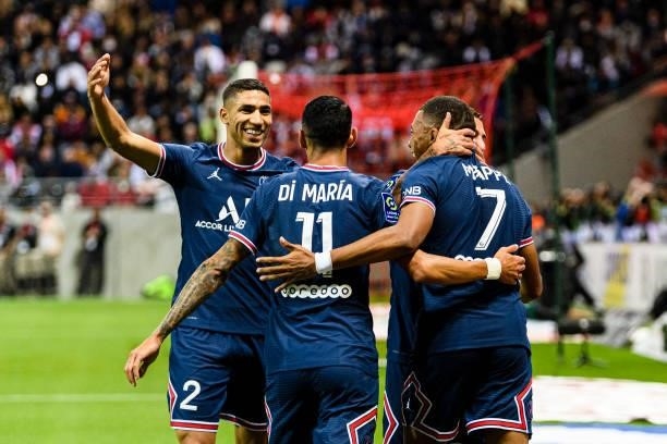 Kylian Mbappe of Paris Saint Germain celebrates his goal with his teammates during the Ligue 1 Uber Eats match between Reims and Paris Saint Germain...