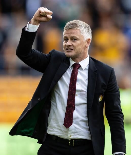 Manchester United's manager Ole Gunnar Solskjaer celebrates victory during the Premier League match between Wolverhampton Wanderers and Manchester...