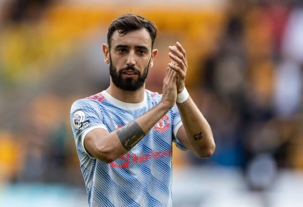 Manchester United's Bruno Fernandes applauds his sides travelling supporters during the Premier League match between Wolverhampton Wanderers and...