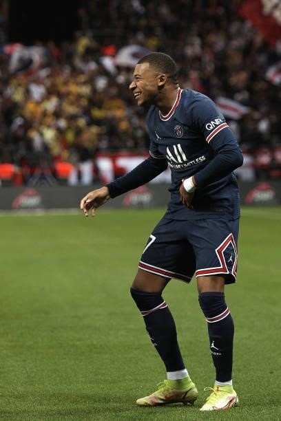 Kylian Mbappe of PSG celebrates after scoring his sides second goal during the Ligue 1 Uber Eats match between Reims and Paris Saint Germain at Stade...