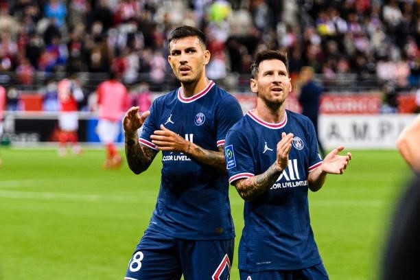 Lionel Messi of Paris Saint Germain and Leandro Paredes meeting PSG supporters during the Ligue 1 Uber Eats match between Reims and Paris Saint...