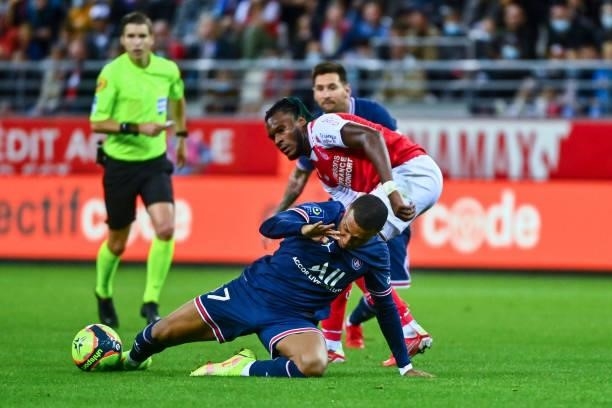 Kylian MBAPPE of PSG and Andreaw GRAVILLON of Reims during the Ligue 1 Uber Eats match between Reims and Paris Saint Germain at Stade Auguste Delaune...