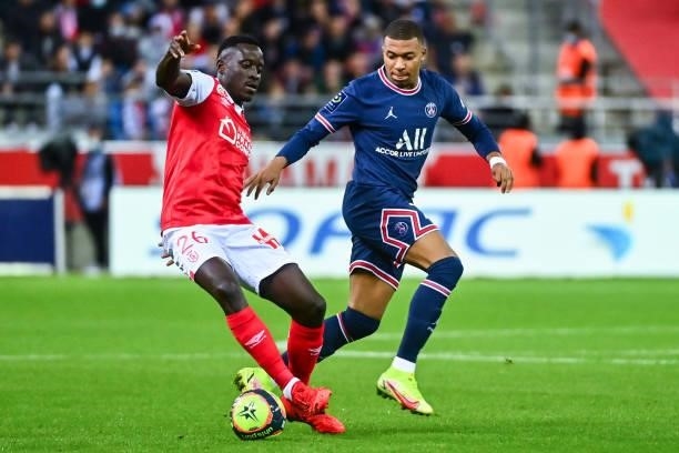 Dion LOPY of Reims and Kylian MBAPPE of PSG during the Ligue 1 Uber Eats match between Reims and Paris Saint Germain at Stade Auguste Delaune on...