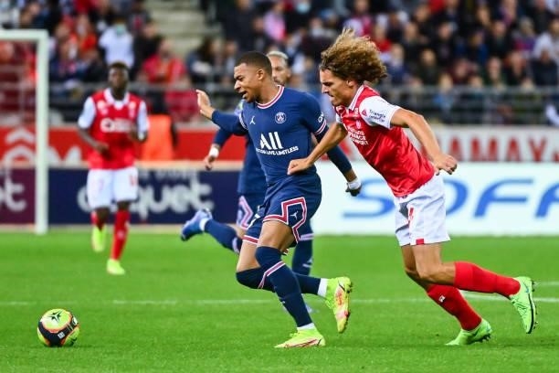 Kylian MBAPPE of PSG and Wout FAES of Reims during the Ligue 1 Uber Eats match between Reims and Paris Saint Germain at Stade Auguste Delaune on...