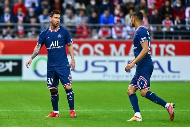 Lionel MESSI of PSG and Achraf HAKIMI of PSG during the Ligue 1 Uber Eats match between Reims and Paris Saint Germain at Stade Auguste Delaune on...