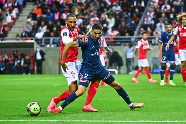 Yunis ABDELHAMID of Reims and Achraf HAKIMI of PSG during the Ligue 1 Uber Eats match between Reims and Paris Saint Germain at Stade Auguste Delaune...