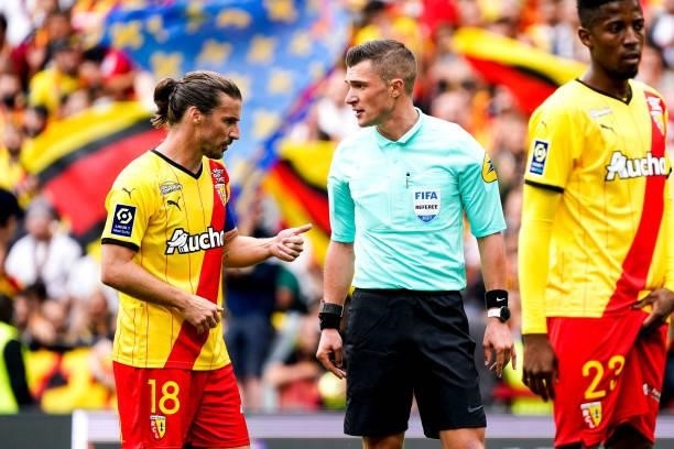 Yannick CAHUZAC of RC Lens talk with Referee Willy DELAJOD during the Ligue 1 Uber Eats match between Lens and Lorient at Stade Bollaert-Delelis on...