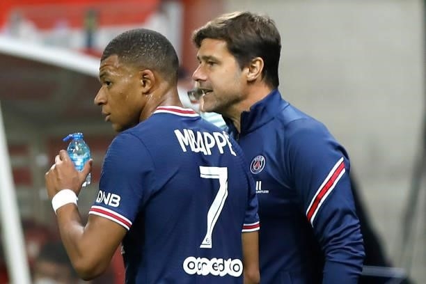 Kylian Mbappe and Mauricio Pochetitno during the French championship Ligue 1 football match between Stade de Reims and Paris Saint-Germain on August...