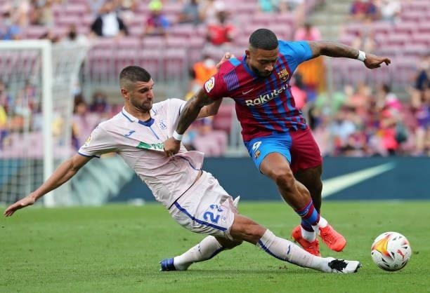 Stefan Mitrovic and Memphis Depay during the match between FC Barcelona and Getafe CF, corresponding to the week 3 of the Liga Santander, played at...