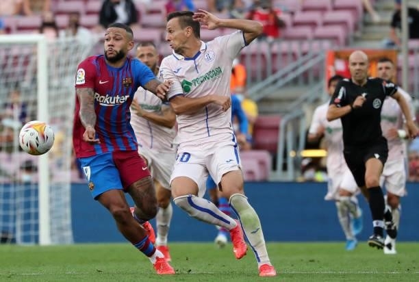 Nemanja Maksimovic and Memphis Depay during the match between FC Barcelona and Getafe CF, corresponding to the week 3 of the Liga Santander, played...
