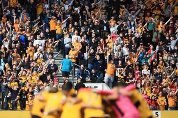 Wolverhampton Wanderers fans cheer their side on before the Premier League match between Wolverhampton Wanderers and Manchester United at Molineux on...