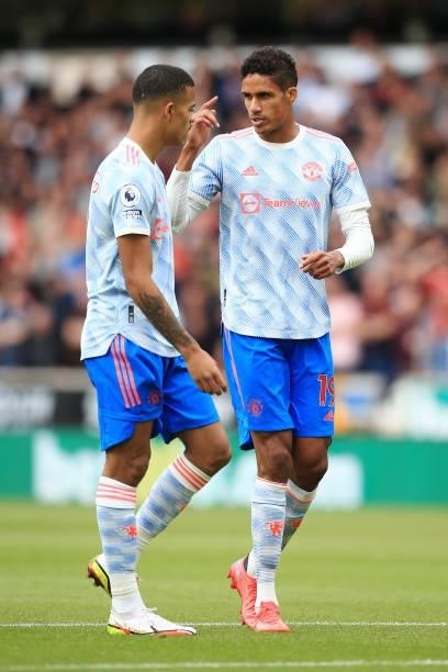 Raphael Varane of Manchester United talks to Mason Greenwood of Manchester United during the Premier League match between Wolverhampton Wanderers and...