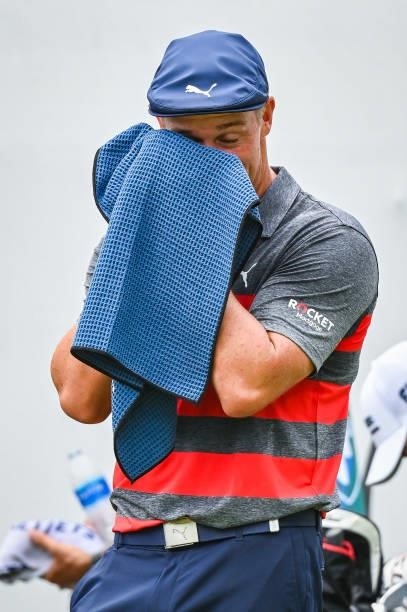 Bryson DeChambeau uses a towel to wipe sweat off on the first tee during the final round of the BMW Championship, the second event of the FedExCup...