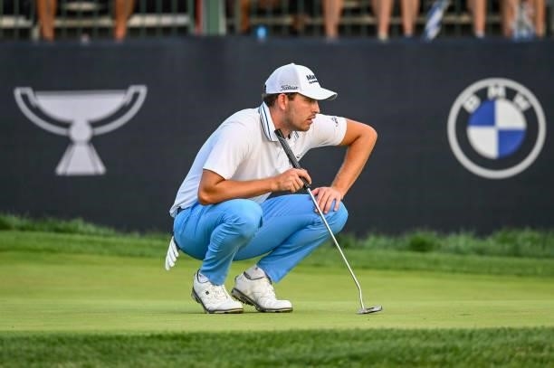 Patrick Cantlay reads his putt on the 17th hole green during a playoff in the final round of the BMW Championship, the second event of the FedExCup...