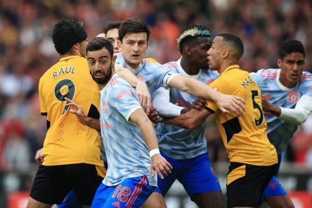 Bruno Fernandes of Manchester United stands firm as Harry Maguire of Manchester United breaks through the Wolverhampton Wanderers defence during the...