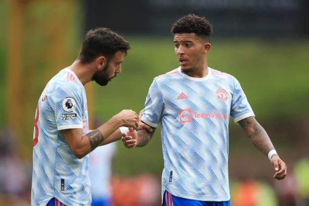 Bruno Fernandes of Manchester United talks to Jadon Sancho of Manchester United during the Premier League match between Wolverhampton Wanderers and...