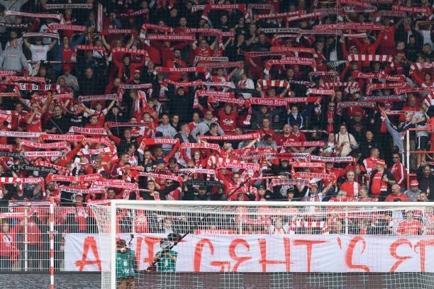 Supporters of 1. FC Union Berlin on the stands during the Bundesliga match between 1. FC Union Berlin and Borussia Moenchengladbach at Stadion An der...