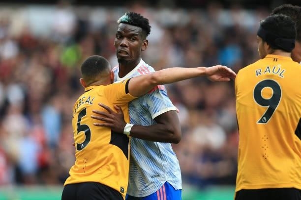 Marcal of Wolverhampton Wanderers tussles with Paul Pogba of Manchester United during the Premier League match between Wolverhampton Wanderers and...