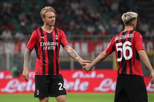 Simon Kjaer of AC Milan gestures with Alexis Saelemaekers during the Serie A match between AC Milan and Cagliari Calcio at Stadio Giuseppe Meazza on...