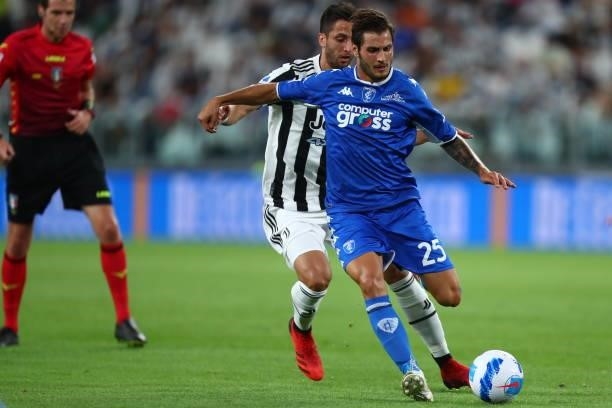 Rodrigo Bentancur of Juventus FC and Filippo Bandinelli of Empoli FC battle for the ball during the Serie A match between Juventus and Empoli FC at...