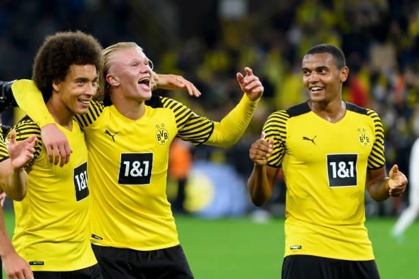 Axel Witsel of Borussia Dortmund, Erling Haaland of Borussia Dortmund and Manuel Akanji of Borussia Dortmund celebrate after winning the Bundesliga...