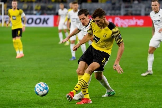 Sebastian Rudy of TSG Hoffenheim and Thomas Meunier of Borussia Dortmund battle for the ball during the Bundesliga match between Borussia Dortmund...