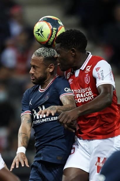 Neymar of PSG and Dion Lopy of Reims battle for the ball during the Ligue 1 Uber Eats match between Reims and Paris Saint Germain at Stade Auguste...