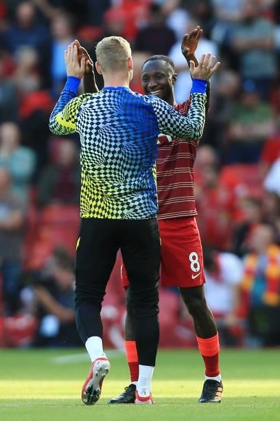 Timo Werner of Chelsea greets Naby Keita of Liverpool before the Premier League match between Liverpool and Chelsea at Anfield on August 28, 2021 in...